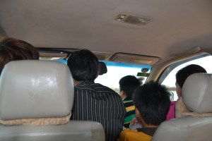 shared taxi..driver is the striped shirt